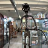 Scultura Artigianale Metallo Dondolante